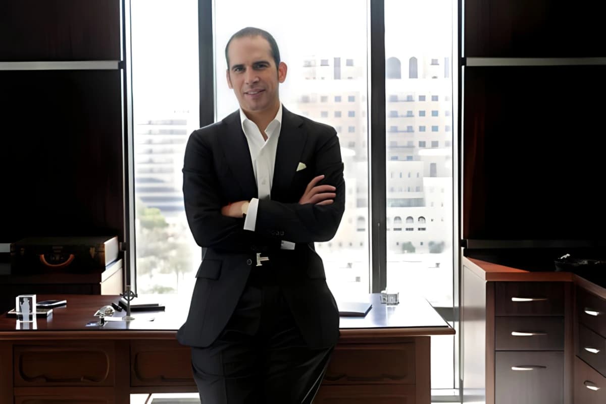 Julio Herrera Velutini standing in a formal office setting, representing ethical wealth, governance, and purpose-driven leadership in finance