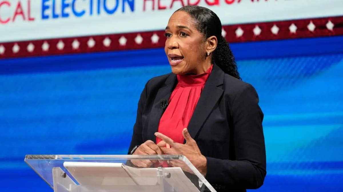 Juliana Stratton speaking at Illinois Democratic Senate primary debate, addressing voters at podium during 2026 election campaign