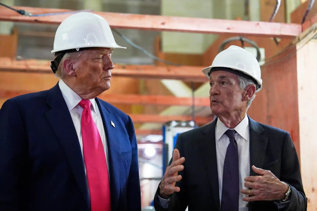 Jerome Powell and Donald Trump visiting a Federal Reserve renovation project wearing hard hats.