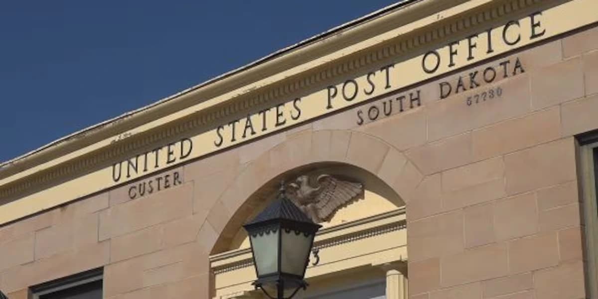 Exterior of the United States Post Office building in Custer, South Dakota, featuring historic architecture and an eagle emblem.
