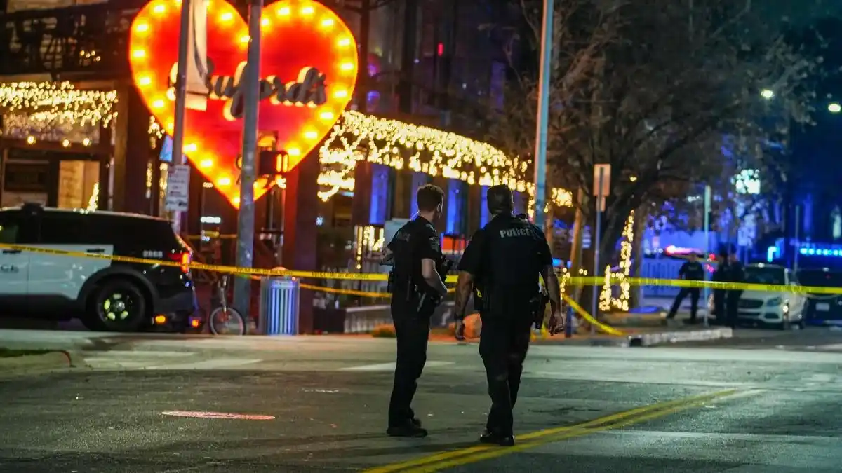 Austin police secure the Sixth Street entertainment district after a mass shooting left three people dead and multiple others injured.