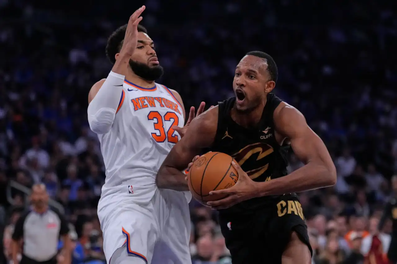 Cavaliers player drives to the basket while Knicks defender contests during the 2026 NBA Playoffs.