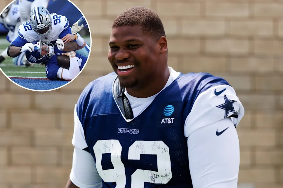 Quinnen Williams poses in Dallas Cowboys jersey after signing $105.9 million contract extension